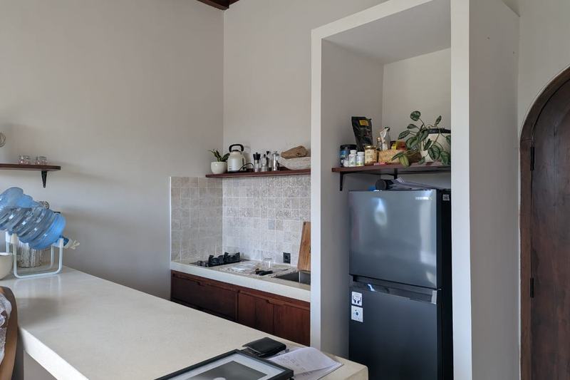 One-bedroom villa in east Uluwatu: kitchen with a fridge and cooktop