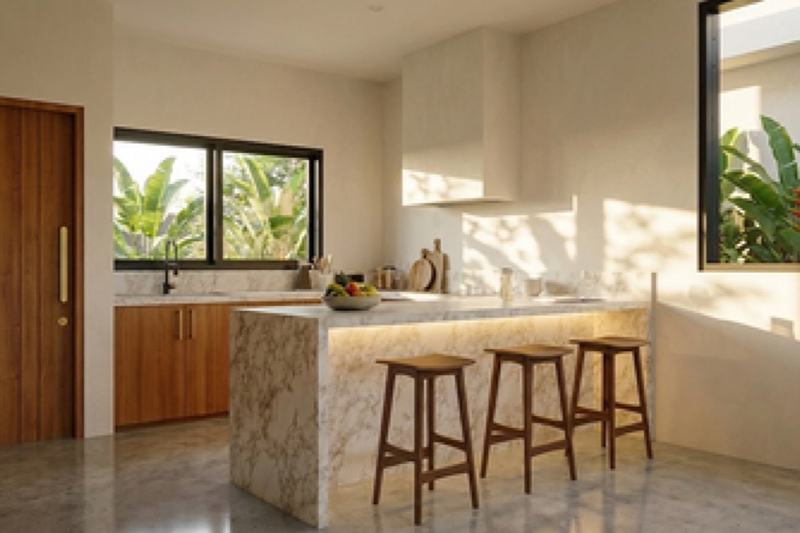 Two-bedroom ocean-view villa in Uluwatu, render: kitchen with a stone island and bar stools