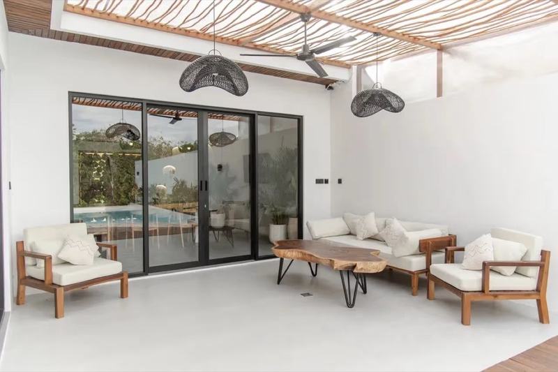 Two-bedroom villa at Nyang Nyang: living room opening onto the pool