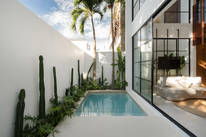 Two-bedroom villa near Nyang Nyang Beach: pool beside the glass-walled living room