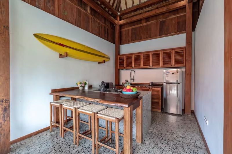 Joglo villa in Padang Padang: kitchen with a bar counter