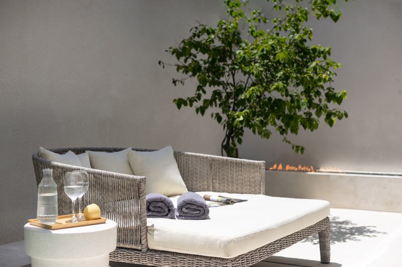 Three-bedroom villa in Umalas: seating around a linear fire pit