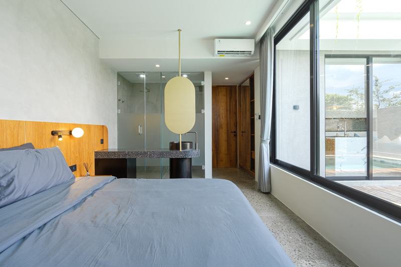 Two-bedroom villa in west Ungasan: bedroom with a glass-walled shower