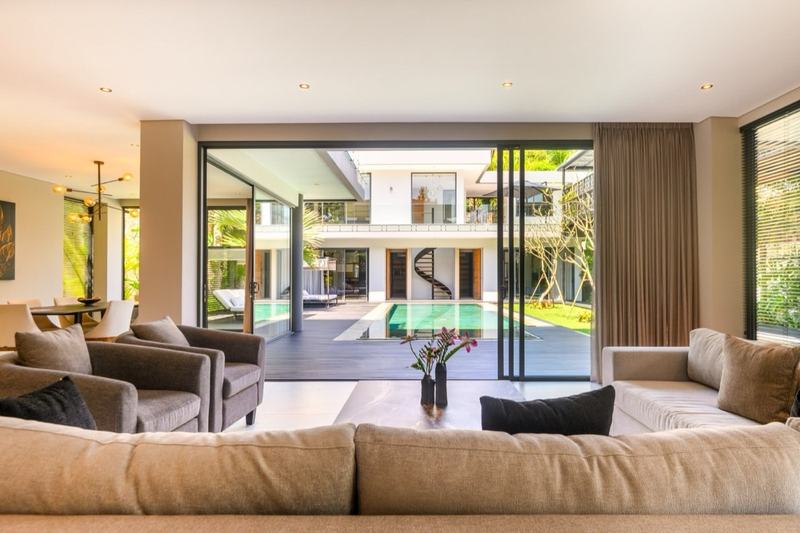 Three-bedroom villa near GWK: living room looking onto the pool