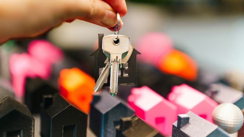 Villa keys held in a hand