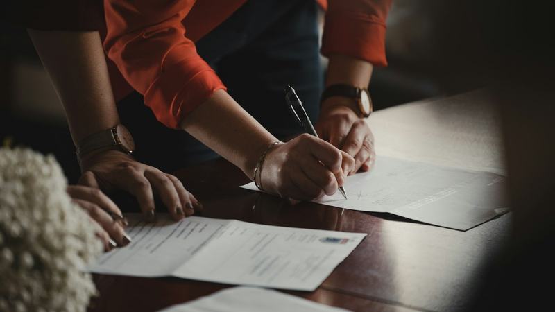 Signing a contract at a notary's office
