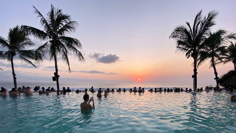 Villa pool among palm trees in Bali
