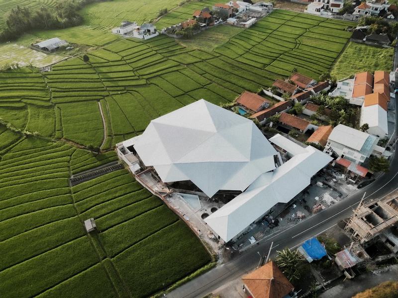 Aerial view of the Jungle Padel club in Seseh, set among rice fields